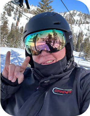 Scot a Clovers employee skiing
