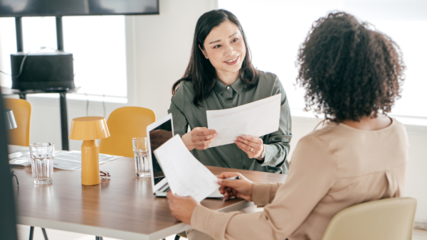 Two women having a discussion at work